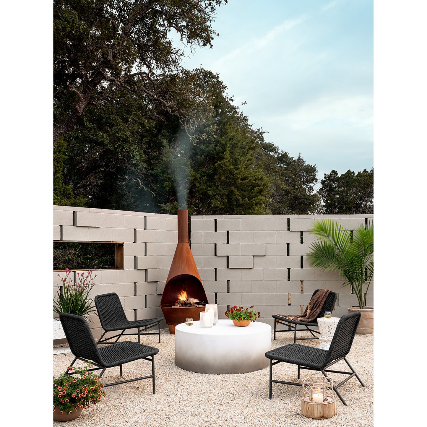 001 SI-1714622 | Lifestyle | Bruno Outdoor Chair by Four Hands. Made from aluminum, 100% polypropylene in a modern style.