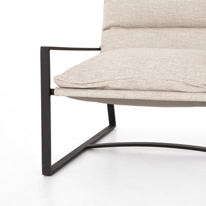 Avon Outdoor Sling Chair by Four Hands in faye sand, bronze. Made from 100% olefin, aluminum, 59% polyurethane foam, 30% polyester fiber, 11% polyester fiber batting in a modern style.