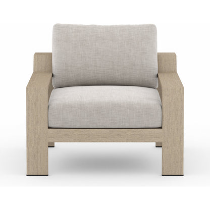 Monterey Outdoor Chair by Four Hands in stone gray, washed brown. Made from 100% olefin, solid fsc®-certified teak, 59% polyurethane foam, 30% polyester fiber, 11% polyester fiber batting in a coastal style.