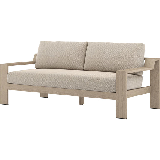Monterey Outdoor Sofa by Four Hands in faye sand, washed brown. Made from 100% olefin, solid fsc®-certified teak, 59% polyurethane foam, 30% polyester fiber, 11% polyester fiber batting in a coastal style.