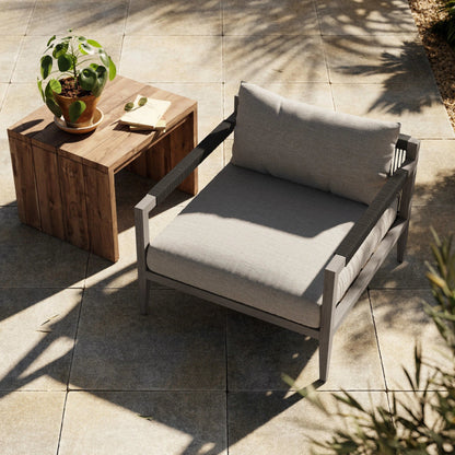 Sherwood Outdoor Chair, Weathered Grey by Four Hands. Made from 100% olefin, solid fsc®-certified teak, 100% polypropylene in a coastal style.