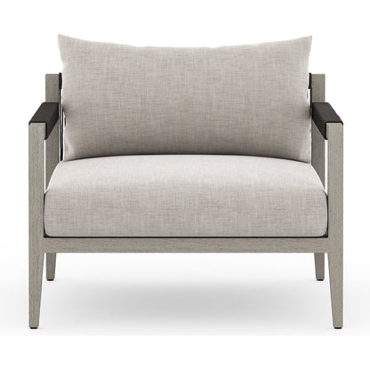 Sherwood Outdoor Chair, Weathered Grey by Four Hands. Made from 100% olefin, solid fsc®-certified teak, 100% polypropylene in a coastal style.