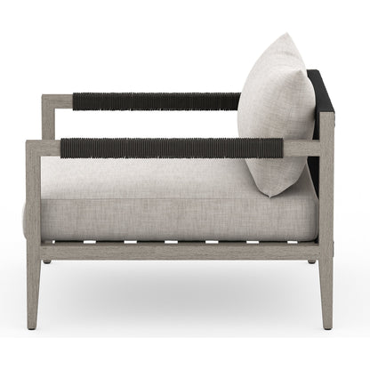 Sherwood Outdoor Chair, Weathered Grey by Four Hands. Made from 100% olefin, solid fsc®-certified teak, 100% polypropylene in a coastal style.