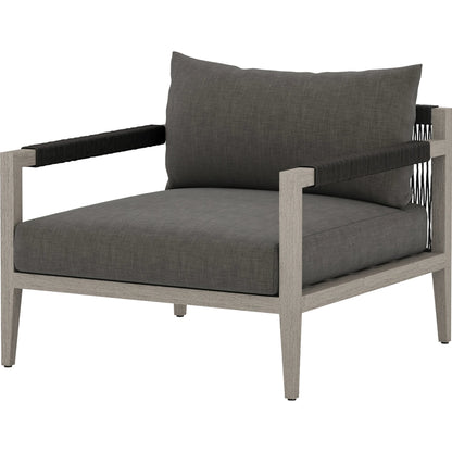 Sherwood Outdoor Chair, Weathered Grey by Four Hands. Made from 100% olefin, solid fsc®-certified teak, 100% polypropylene in a coastal style.