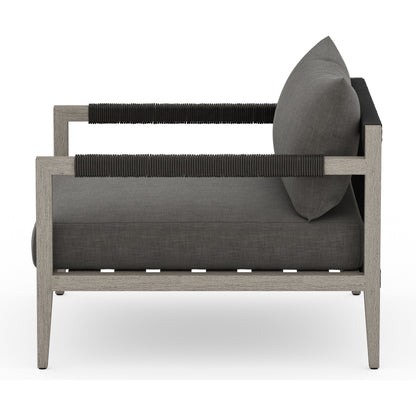 Sherwood Outdoor Chair, Weathered Grey by Four Hands. Made from 100% olefin, solid fsc®-certified teak, 100% polypropylene in a coastal style.