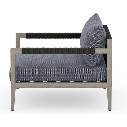 Sherwood Outdoor Chair, Weathered Grey by Four Hands. Made from 100% olefin, solid fsc®-certified teak, 100% polypropylene in a coastal style.