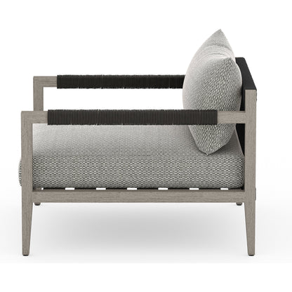Sherwood Outdoor Chair, Weathered Grey by Four Hands. Made from 100% olefin, solid fsc®-certified teak, 100% polypropylene in a coastal style.