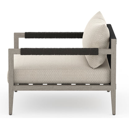 Sherwood Outdoor Chair, Weathered Grey by Four Hands. Made from 100% olefin, solid fsc®-certified teak, 100% polypropylene in a coastal style.