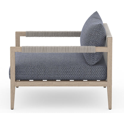 Sherwood Outdoor Chair, Washed Brown by Four Hands. Made from 100% olefin, solid fsc®-certified teak, 100% polypropylene in a coastal style.