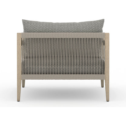 Sherwood Outdoor Chair, Washed Brown by Four Hands. Made from 100% olefin, solid fsc®-certified teak, 100% polypropylene in a coastal style.