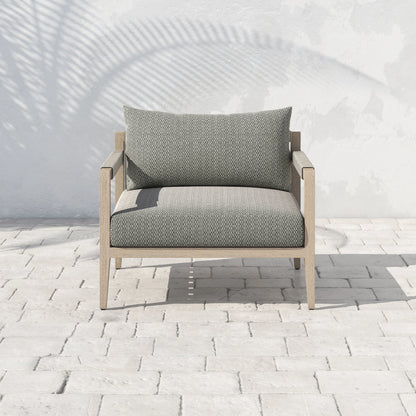 Sherwood Outdoor Chair, Washed Brown by Four Hands. Made from 100% olefin, solid fsc®-certified teak, 100% polypropylene in a coastal style.