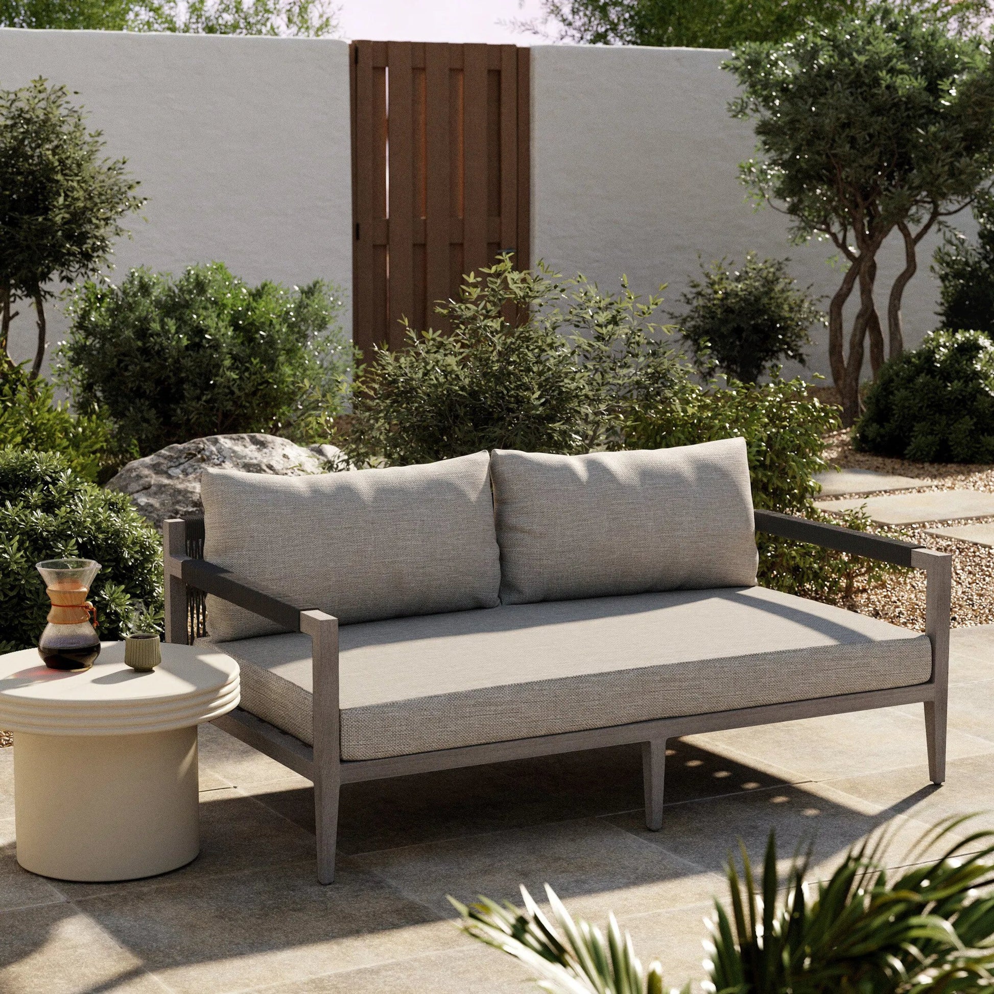 Sherwood Outdoor Sofa, Weathered Grey by Four Hands. Made from 100% olefin, solid fsc®-certified teak, 100% polypropylene in a coastal style.