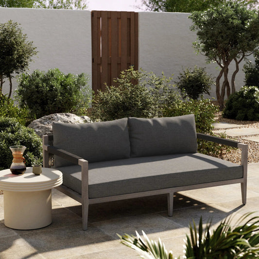 Sherwood Outdoor Sofa, Weathered Grey by Four Hands. Made from 100% olefin, solid fsc®-certified teak, 100% polypropylene in a coastal style.