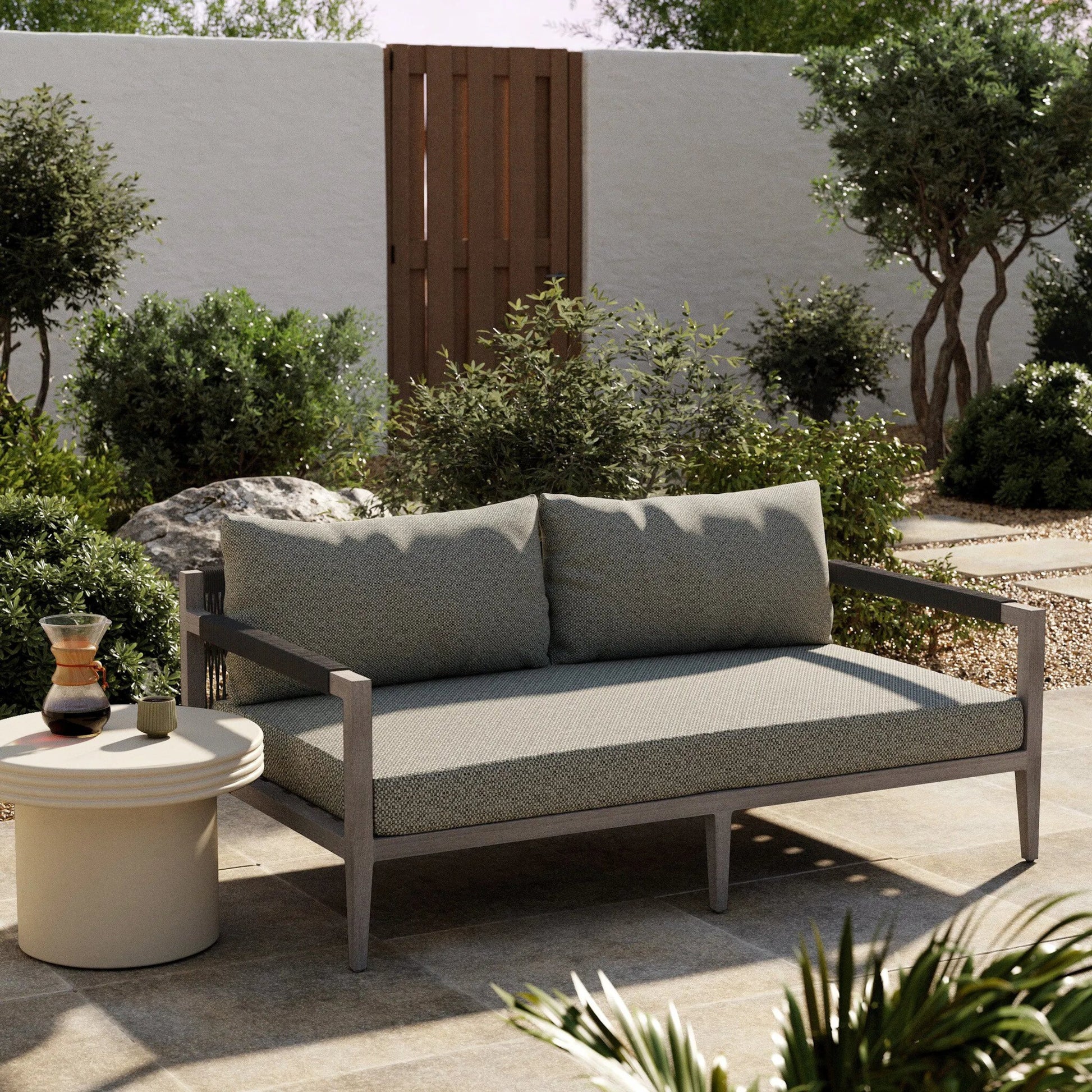 Sherwood Outdoor Sofa, Weathered Grey by Four Hands. Made from 100% olefin, solid fsc®-certified teak, 100% polypropylene in a coastal style.