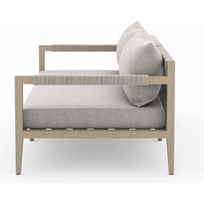 Sherwood Outdoor Sofa, Washed Brown by Four Hands. Made from 100% olefin, solid fsc®-certified teak, 100% polypropylene in a coastal style.