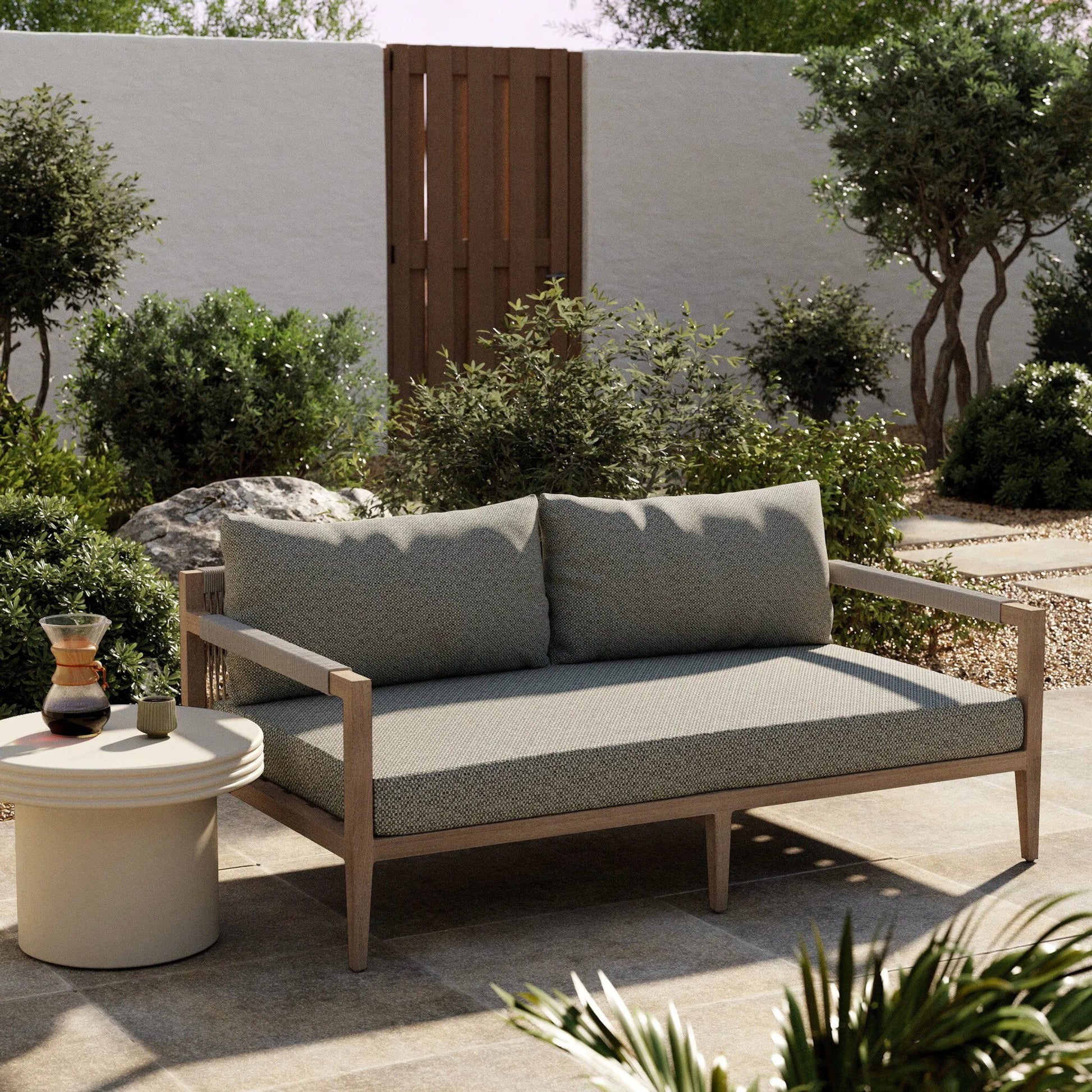 Sherwood Outdoor Sofa, Washed Brown by Four Hands. Made from 100% olefin, solid fsc®-certified teak, 100% polypropylene in a coastal style.