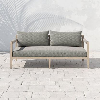 Sherwood Outdoor Sofa, Washed Brown by Four Hands. Made from 100% olefin, solid fsc®-certified teak, 100% polypropylene in a coastal style.