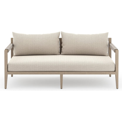 Sherwood Outdoor Sofa, Washed Brown by Four Hands. Made from 100% olefin, solid fsc®-certified teak, 100% polypropylene in a coastal style.