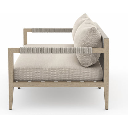 Sherwood Outdoor Sofa, Washed Brown by Four Hands. Made from 100% olefin, solid fsc®-certified teak, 100% polypropylene in a coastal style.