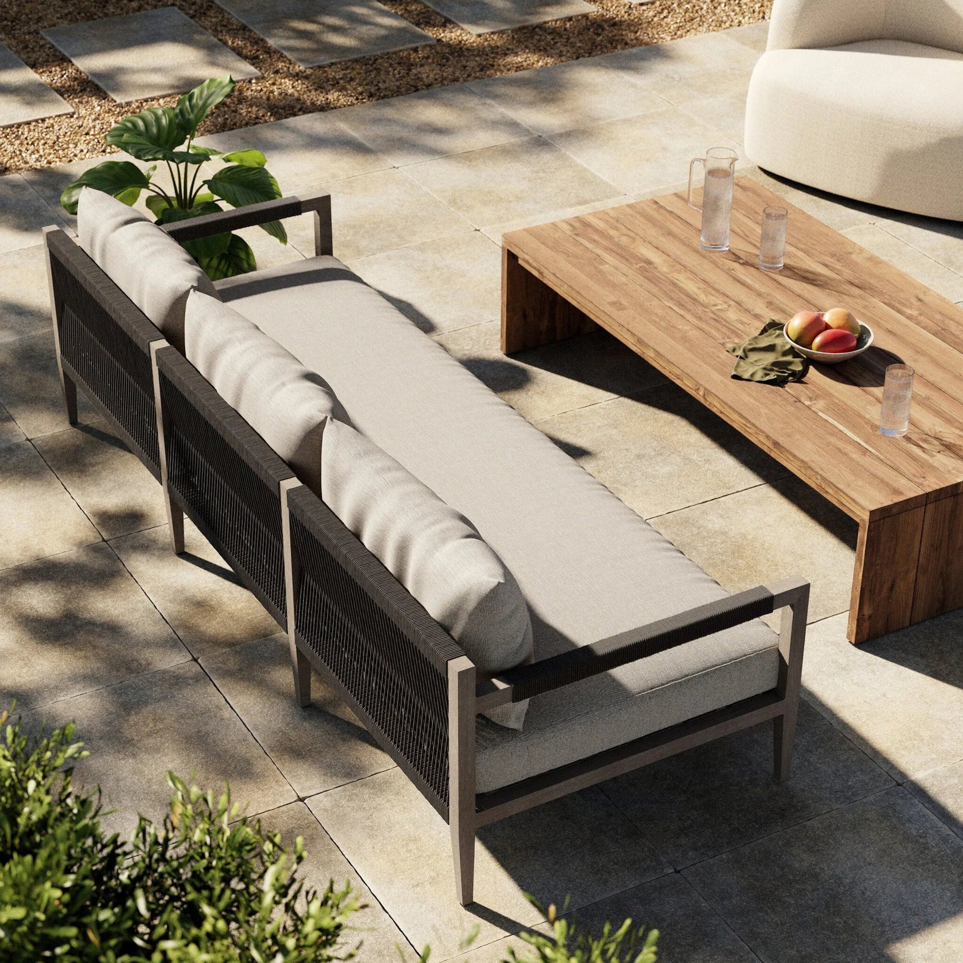 Sherwood Outdoor Sofa, Weathered Grey by Four Hands. Made from 100% olefin, solid fsc®-certified teak, 100% polypropylene in a coastal style.