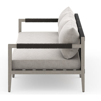 Sherwood Outdoor Sofa, Weathered Grey by Four Hands. Made from 100% olefin, solid fsc®-certified teak, 100% polypropylene in a coastal style.