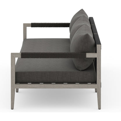 Sherwood Outdoor Sofa, Weathered Grey by Four Hands. Made from 100% olefin, solid fsc®-certified teak, 100% polypropylene in a coastal style.