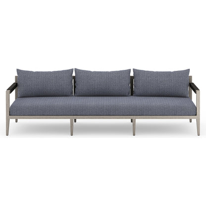 Sherwood Outdoor Sofa, Weathered Grey by Four Hands. Made from 100% olefin, solid fsc®-certified teak, 100% polypropylene in a coastal style.