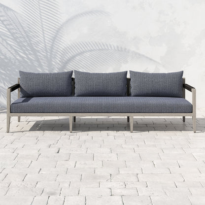 Sherwood Outdoor Sofa, Weathered Grey by Four Hands. Made from 100% olefin, solid fsc®-certified teak, 100% polypropylene in a coastal style.