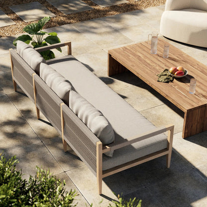 Sherwood Outdoor Sofa, Washed Brown by Four Hands. Made from 100% olefin, solid fsc®-certified teak, 100% polypropylene in a coastal style.