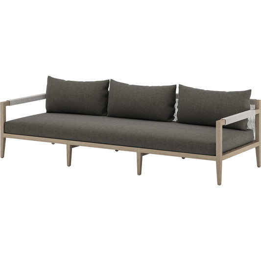 Sherwood Outdoor Sofa, Washed Brown by Four Hands. Made from 100% olefin, solid fsc®-certified teak, 100% polypropylene in a coastal style.