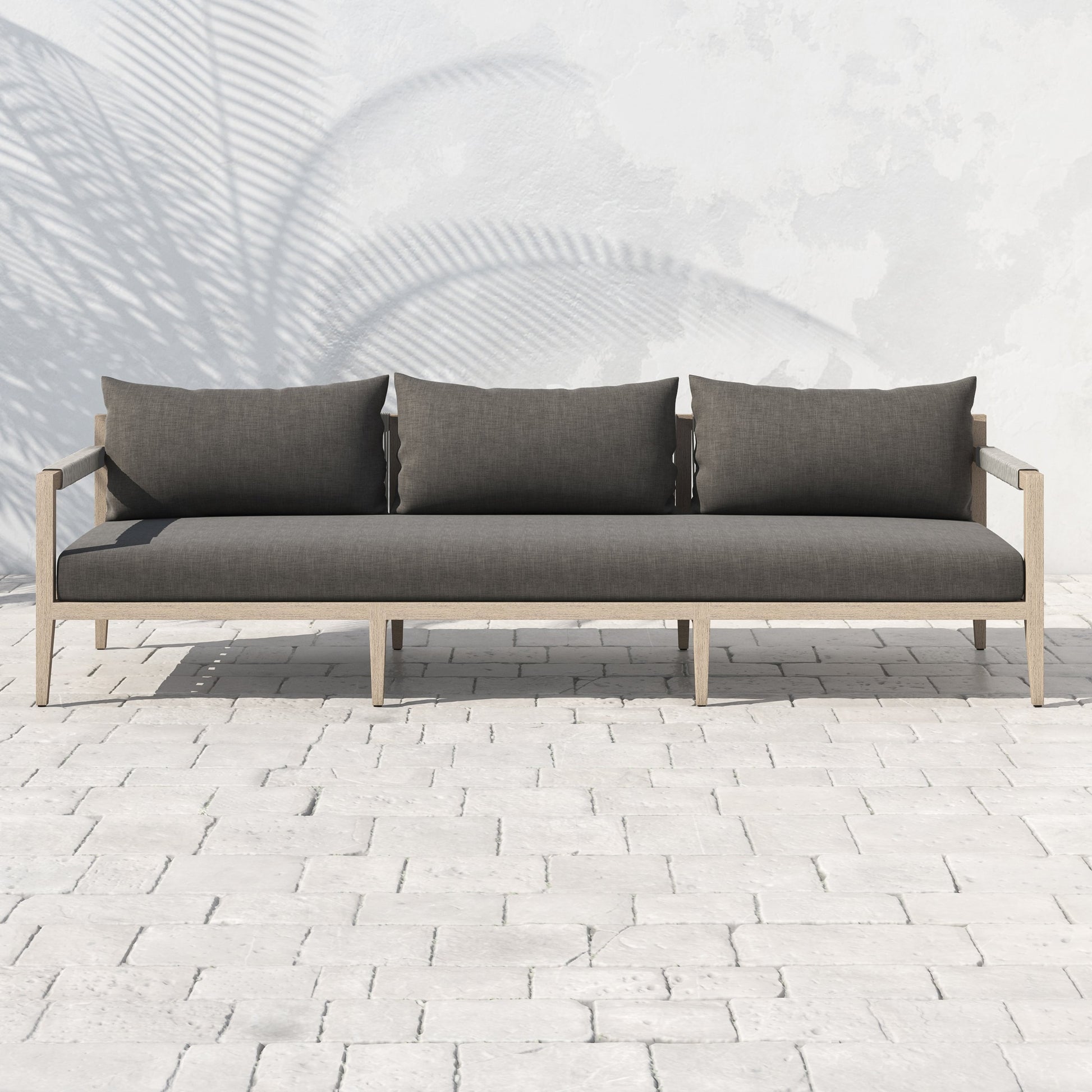 Sherwood Outdoor Sofa, Washed Brown by Four Hands. Made from 100% olefin, solid fsc®-certified teak, 100% polypropylene in a coastal style.