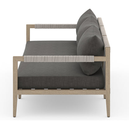 Sherwood Outdoor Sofa, Washed Brown by Four Hands. Made from 100% olefin, solid fsc®-certified teak, 100% polypropylene in a coastal style.
