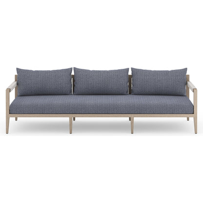 Sherwood Outdoor Sofa, Washed Brown by Four Hands. Made from 100% olefin, solid fsc®-certified teak, 100% polypropylene in a coastal style.