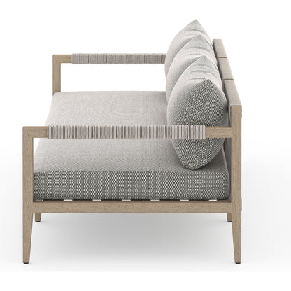 Sherwood Outdoor Sofa, Washed Brown by Four Hands. Made from 100% olefin, solid fsc®-certified teak, 100% polypropylene in a coastal style.