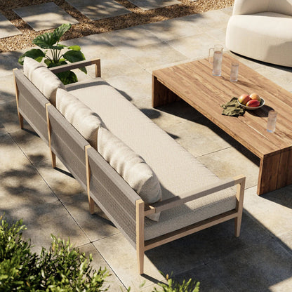 Sherwood Outdoor Sofa, Washed Brown by Four Hands. Made from 100% olefin, solid fsc®-certified teak, 100% polypropylene in a coastal style.
