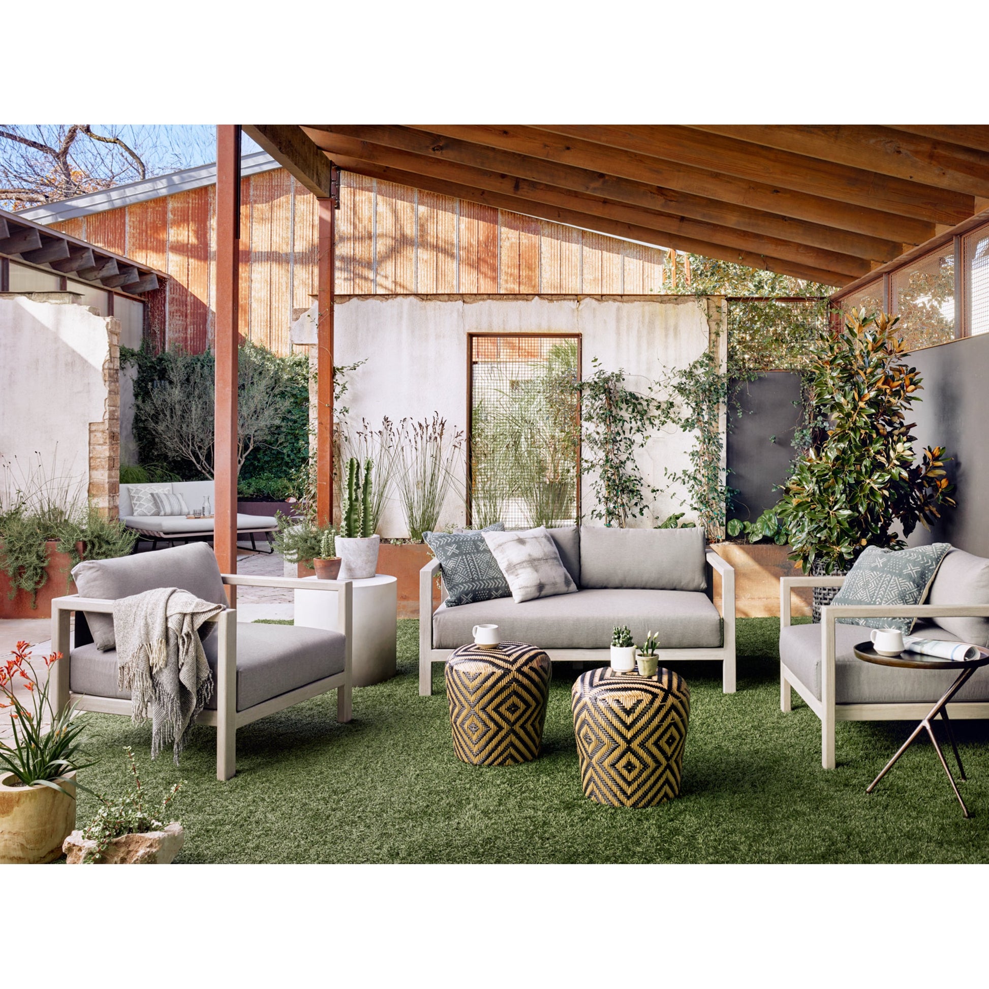 Sonoma Outdoor Chair by Four Hands. Made from 100% olefin, aluminum, 100% polypropylene in a coastal style.