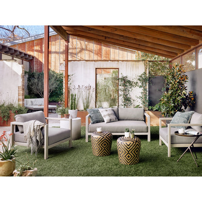 Sonoma Outdoor Chair by Four Hands. Made from 100% olefin, aluminum, 100% polypropylene in a coastal style.