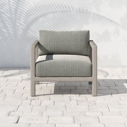 Sonoma Outdoor Chair by Four Hands. Made from 100% olefin, aluminum, 100% polypropylene in a coastal style.