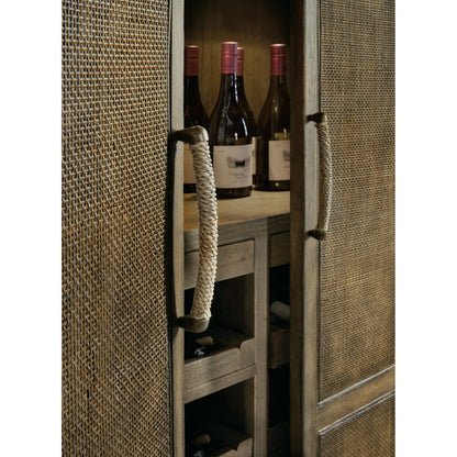 Sundance Bar Cabinet by Hooker Furniture in cliffside. Made from pecan veneers, rattan, glass, puck light, self-closing undermount drawer guides in a transitional style.