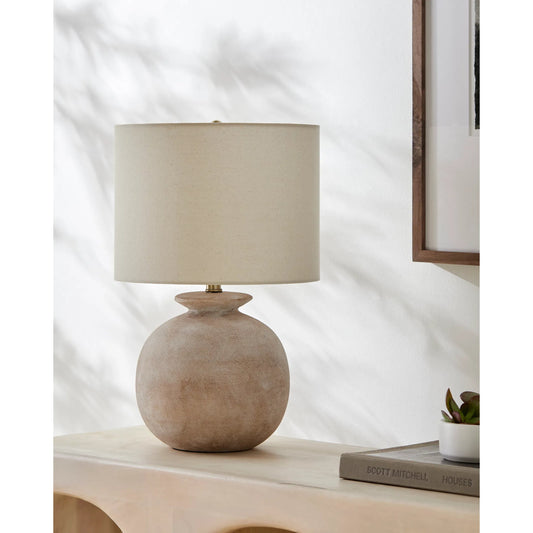 Kaia Accent Table Lamp 531694 by Livabliss in body: cream; shade: beige; finial: metallic - brass; harp: metallic - brass; cord: translucent and coloredplated. Made from resin, linen, polyester, iron in a unique style.