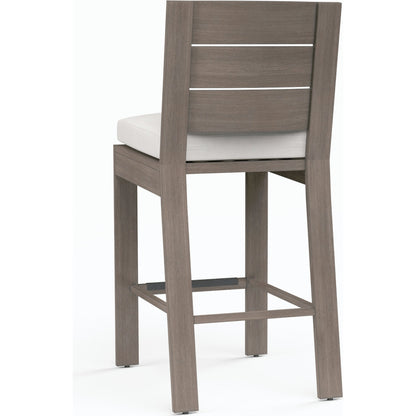 Laguna Outdoor Counter Stool by Sunset West in browns. Made from aluminum in a modern style.