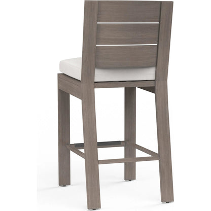 Laguna Outdoor Barstool in Canvas Flax by Sunset West in driftwood. Made from aluminum in a modern style.