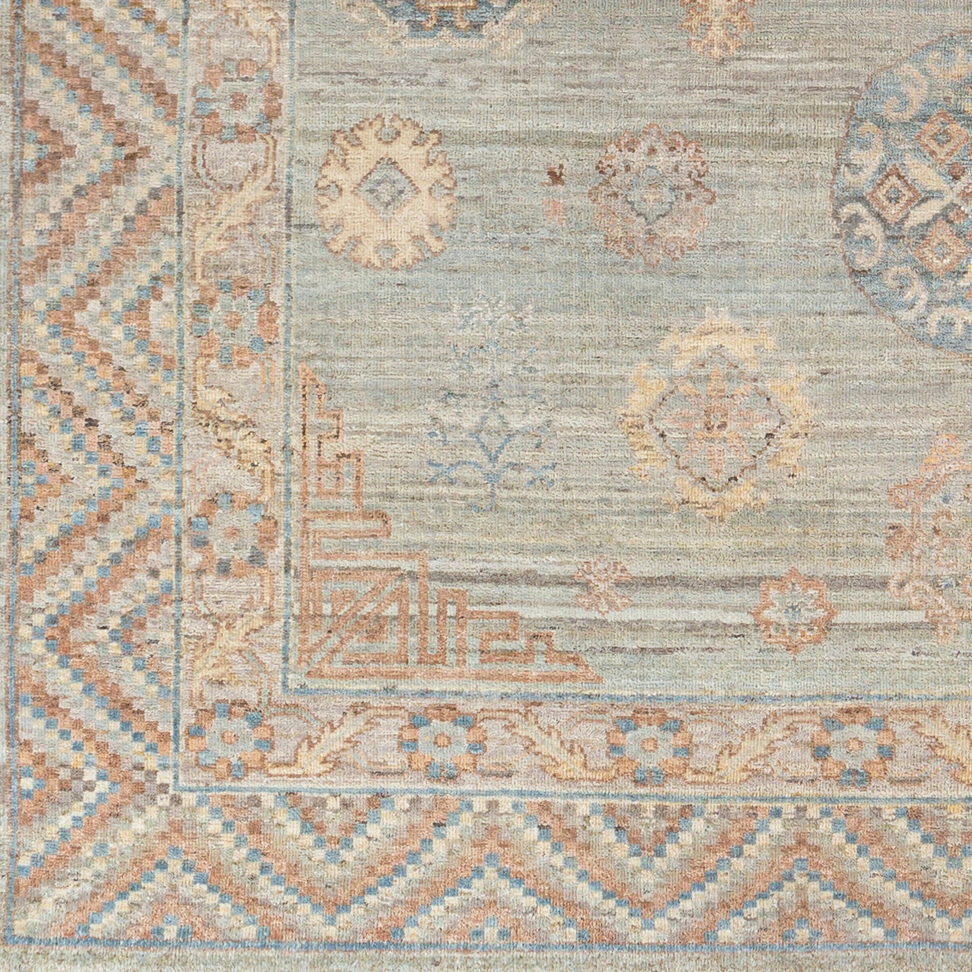 Khotan KHT-2302 Rug by Surya in sage, blue, mauve, light beige, cream, camel. Made from 100% wool in a unique style.