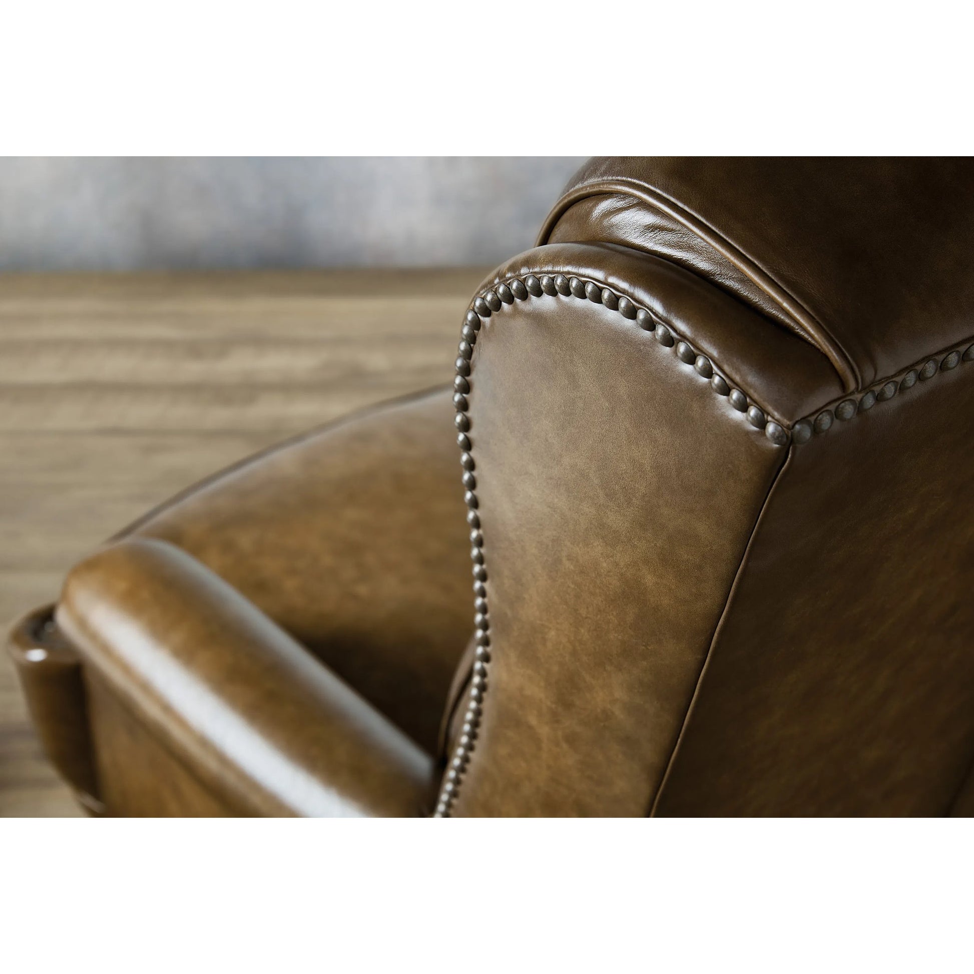Tucker Executive Swivel Tilt Chair by Hooker Furniture in nature and espresso brown. Made from leather in a unique style.