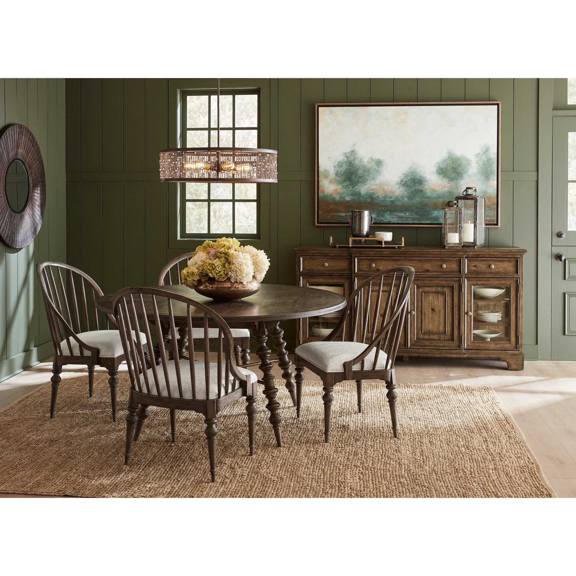 Revival Row Round Table by Pulaski Furniture in chimney smoke. Made from rubberwood in a traditional style.