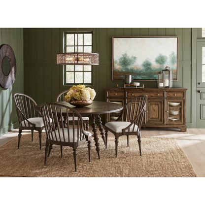 Revival Row Round Table by Pulaski Furniture in chimney smoke. Made from rubberwood in a traditional style.