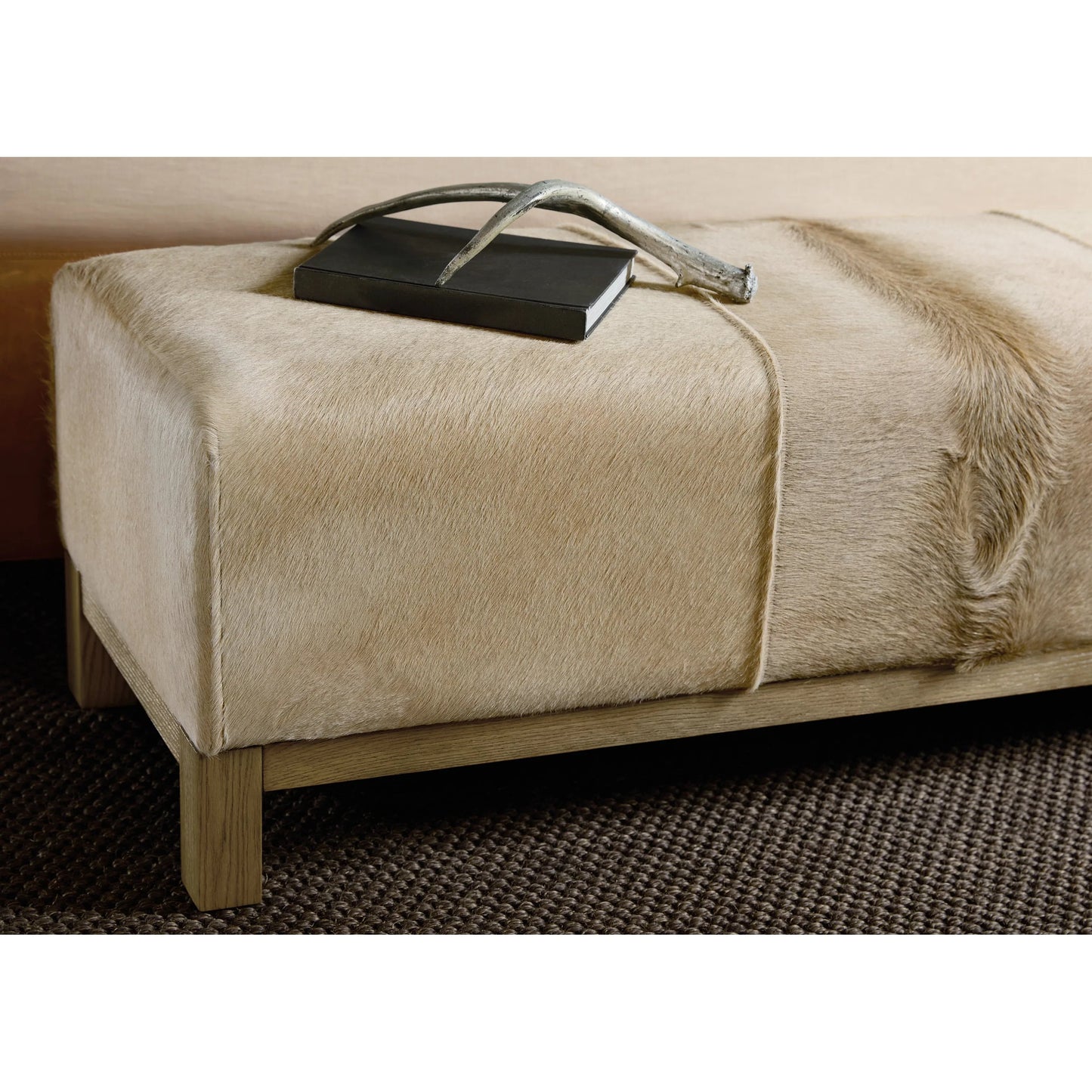 003 SI-2458416 | Closeup | Melange Holy Cow Bench by Hooker Furniture in light wood oak, beige hair on hide leather. Made from solid oak wood, hair on hide leather, fabric, 82% polyester, 13% acrylic, 5% linen in a transitional style.