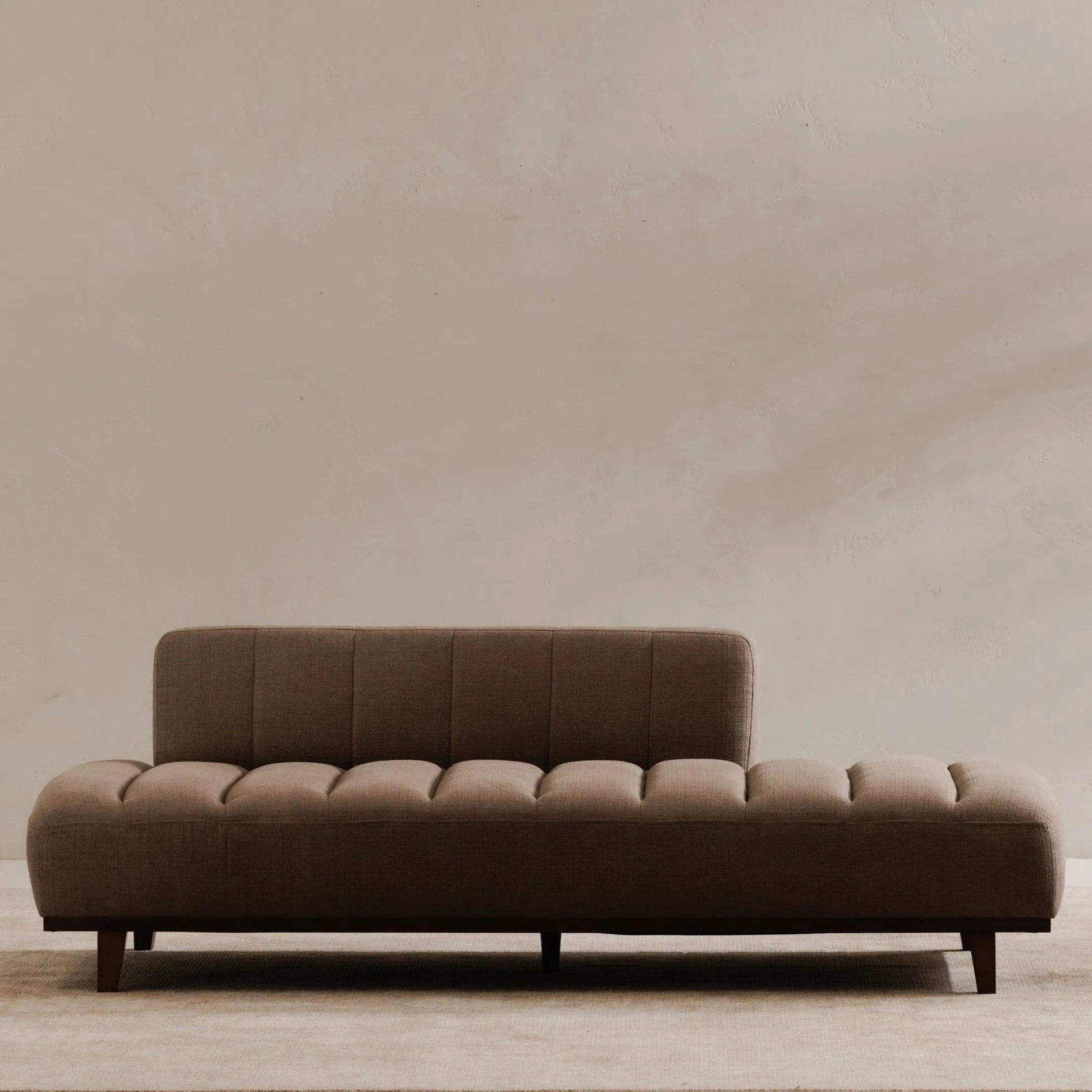 Bennett Daybed by Moe's Home Collection in taupe. Made from 95% polyester, 5% nylon, solid wood, plywood, high density foam, polyfill cushions, plastic black legs in a unique style.