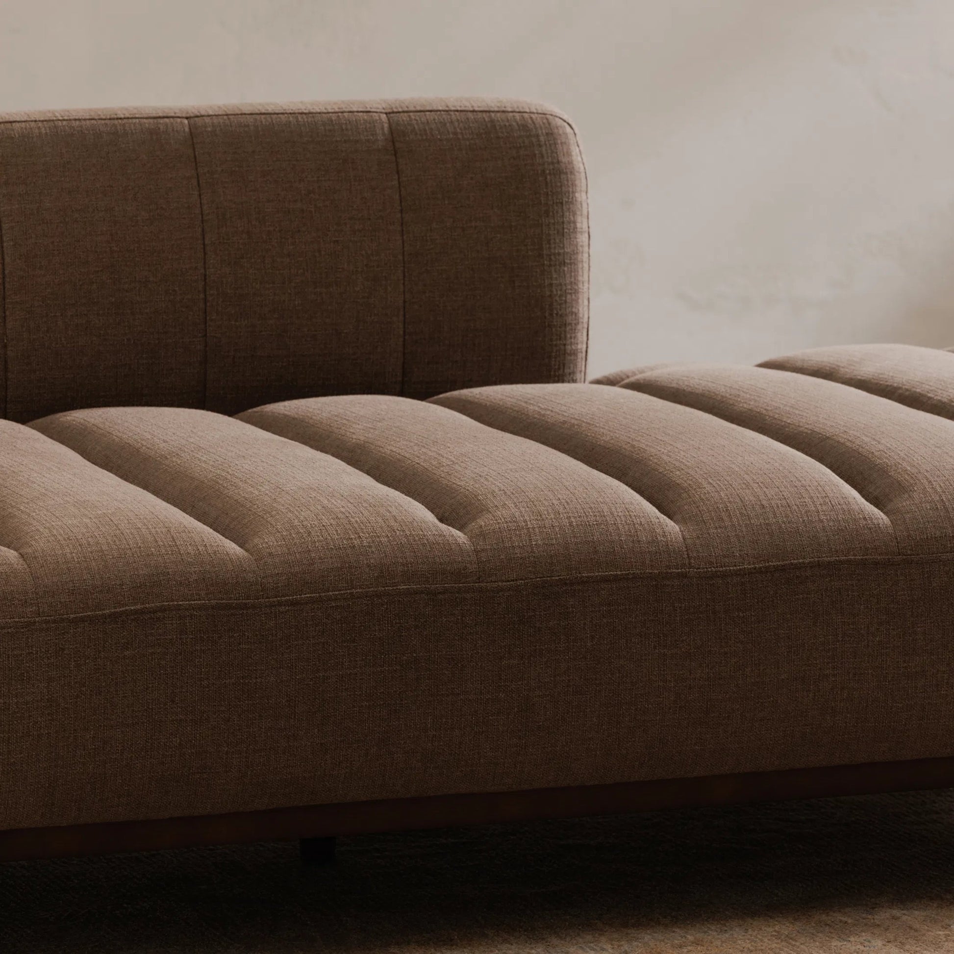 Bennett Daybed by Moe's Home Collection in taupe. Made from 95% polyester, 5% nylon, solid wood, plywood, high density foam, polyfill cushions, plastic black legs in a unique style.