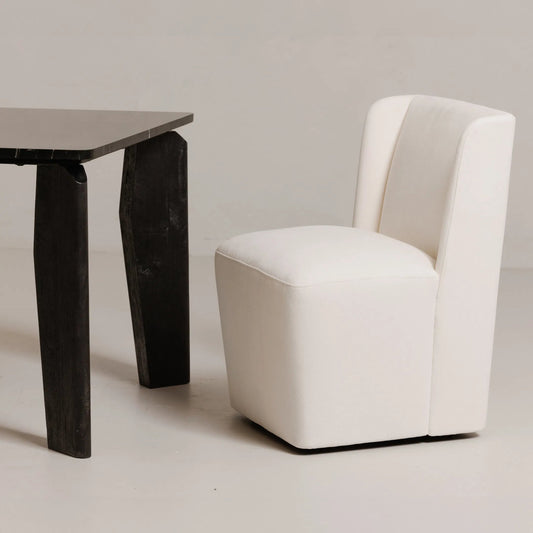 Cormac Rolling Dining Chair Performance Fabric by Moe's Home Collection. Made from upholstery: 100% polyester, poplar multi, layer board, laminated veneer lumber, high density foam, metal wheels in a transitional style.